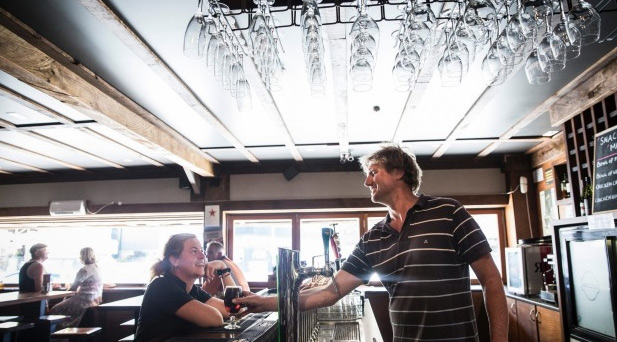 bar owner serving a drink